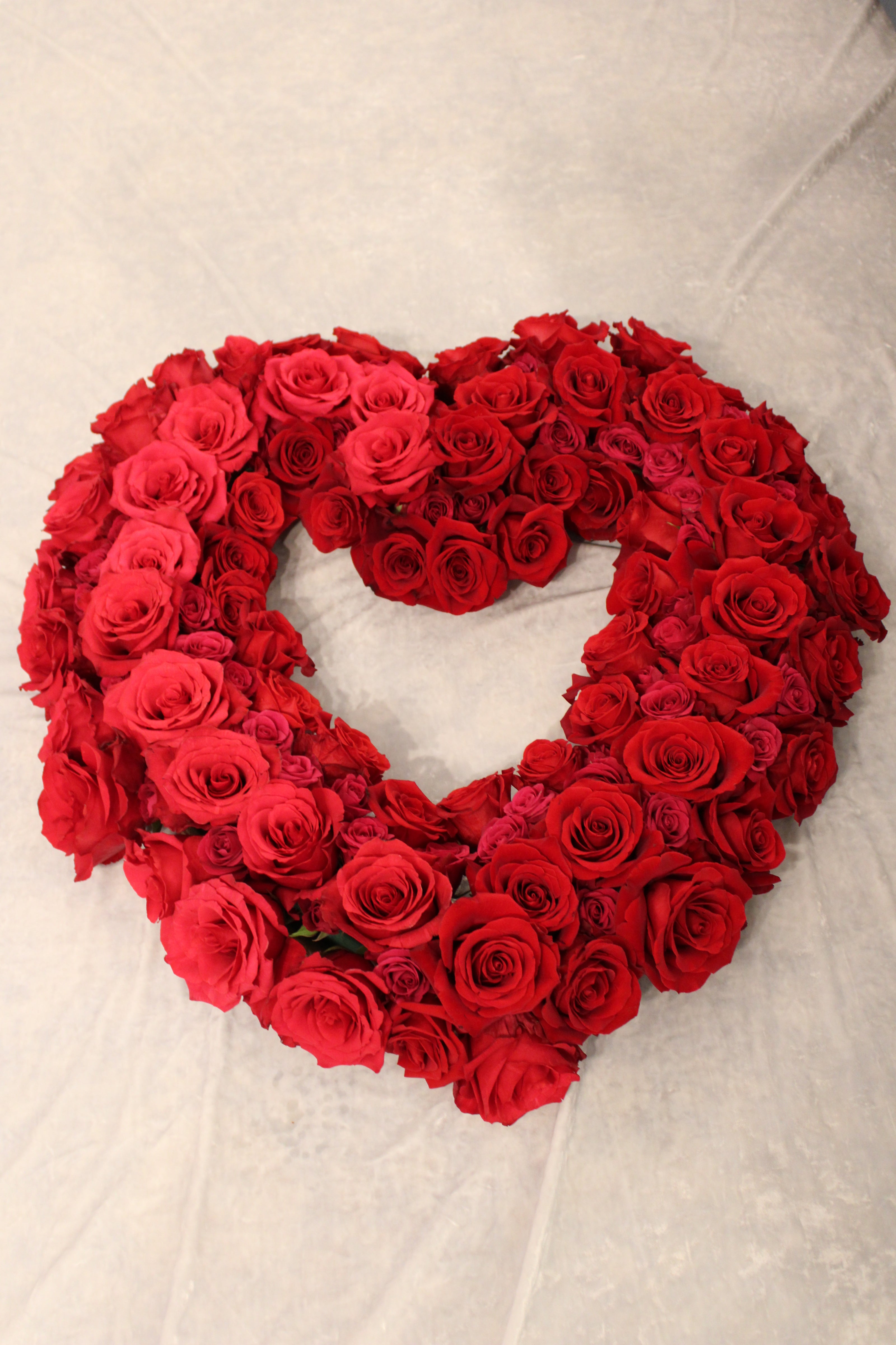 Floral proposal heart - oasis paper mache heart filled with red roses. Red romantic floral heart for proposal - to go on easel stand.